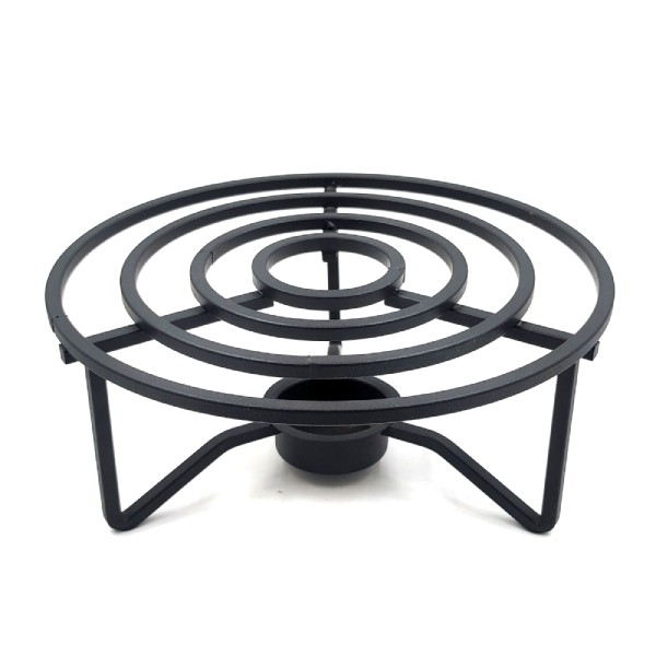 Soporte para tetera de hierro fundido con hueco para una vela.